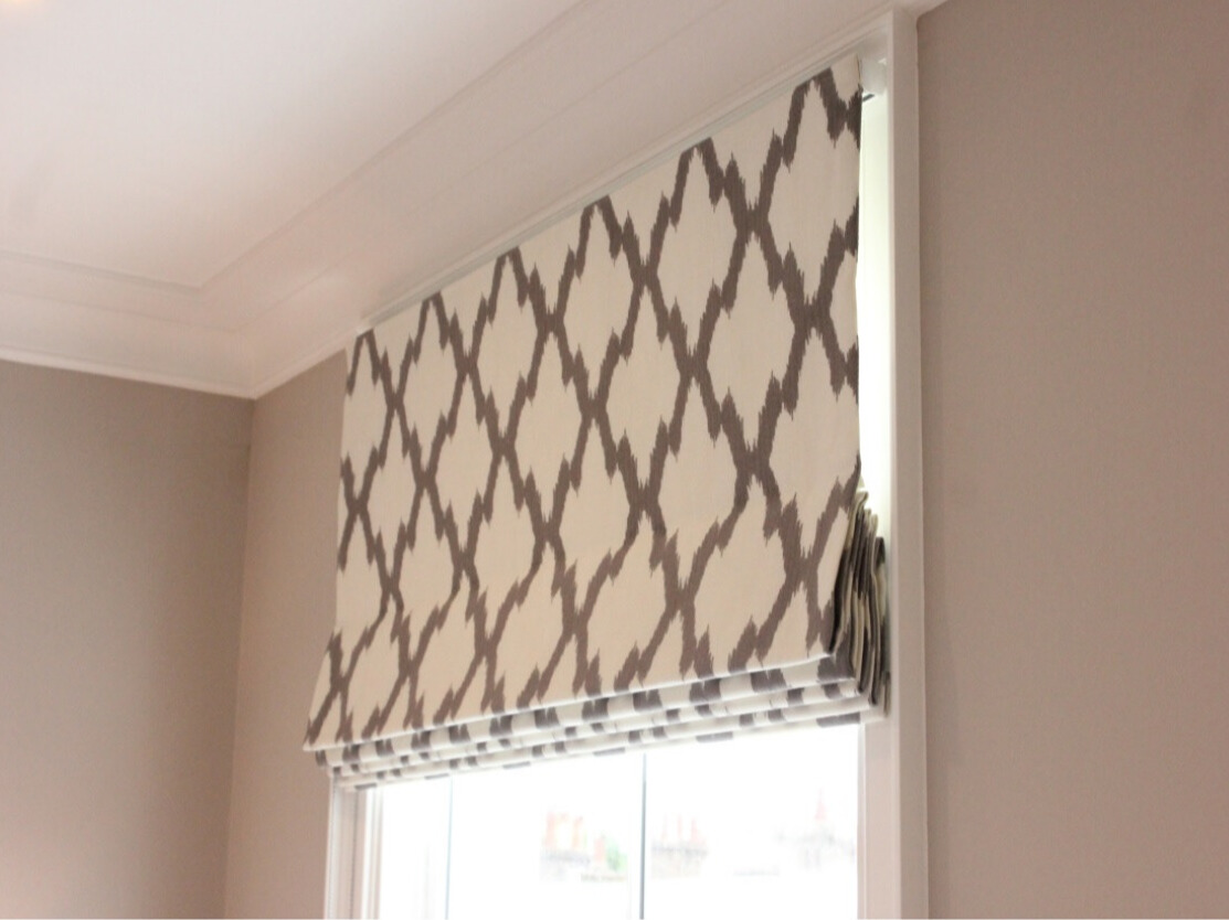 Elegant Roman blinds in a cozy bedroom