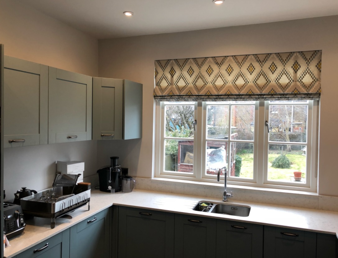 Custom Roman blinds in a cozy living room