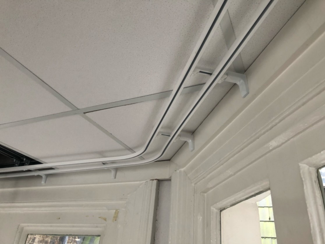 Curtain track fitting in a modern living space